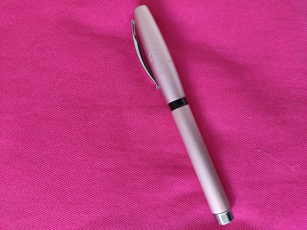 Faber-Castell Essentio in Rose Gold Aluminium on a Pink Fabric Background